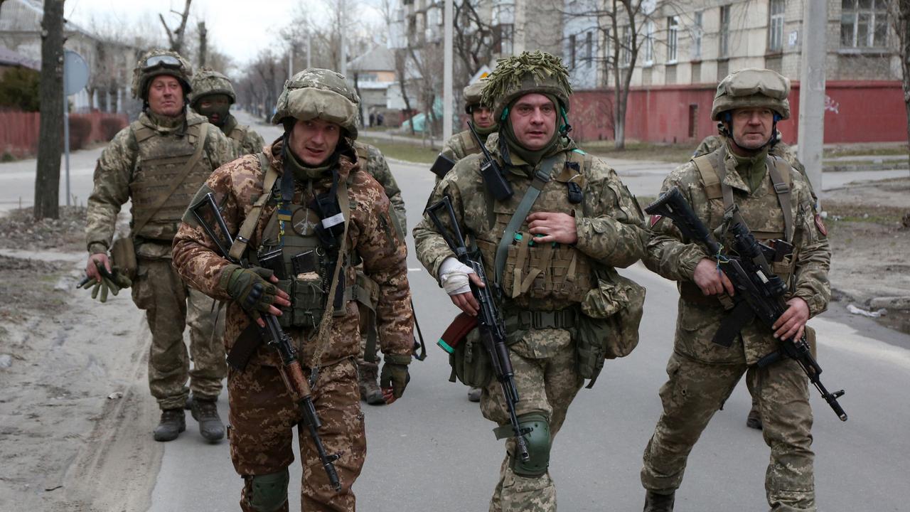 Servicemen of Ukrainian Military Forces walk in the small town of Severodonetsk in the Donetsk Region. Picture: Anatolii STEPANOV/AFP