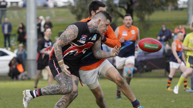 SFL: Frankston’s Benjamin Black cops a bump. Picture: Valeriu Campan