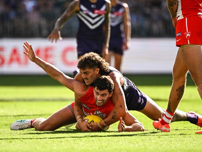 Tom McCartin is tackled by Luke Jackson during the Swans’ win over Fremantle. Picture: Daniel Carson/AFL Photos via Getty Images.