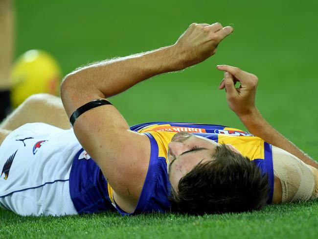 Andrew Gaff unconscious after being hit by Tom Jonas. Picture: Mark Brake.