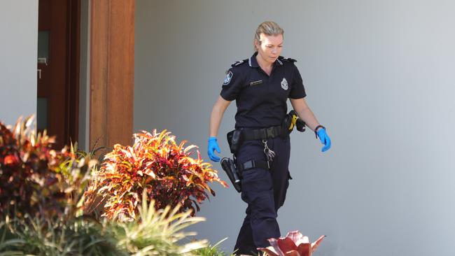 A police officer at the scene of the shooting this morning. Picture: Glenn Hampson.