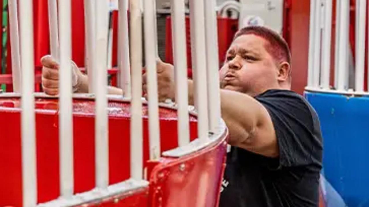 Australian strongman Troy Conley-Magnusson attempts the world record for the fastest spin of a full-size ferris wheel.