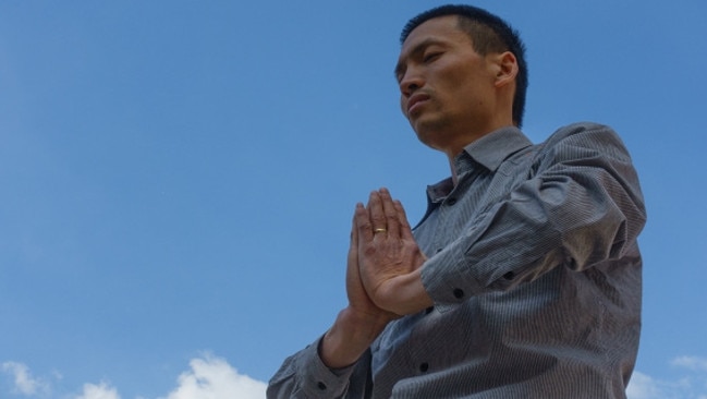 A Chinese man practices Falun Gong, a spiritual belief based on love and respect.