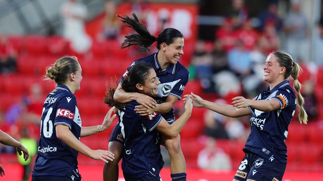 ADELAIDE, AUSTRALIA - MAY 04: Claudia Bunge of Melbourne Victory celebrates her second goal with Alex Chidiac of Melbourne Victory  and team mates during the First Leg of the A-League Women's Semi Final between Adelaide United and Melbourne Victory at Coopers Stadium, on May 04, 2025, in Adelaide, Australia. (Photo by Sarah Reed/Getty Images)