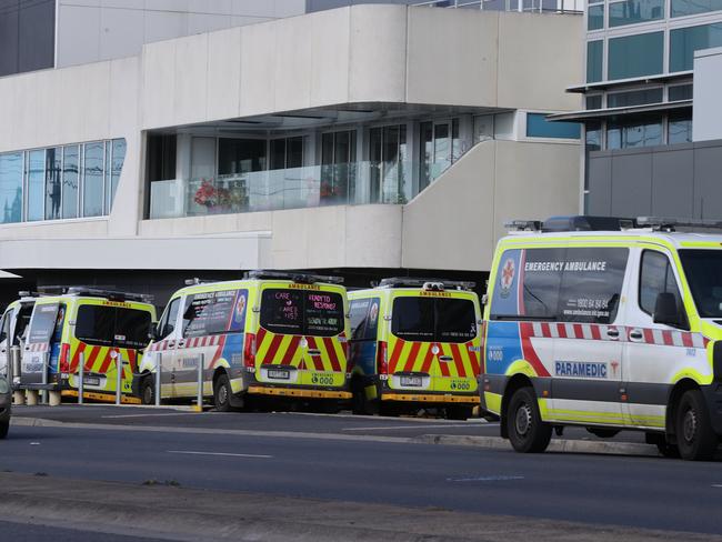 Some of the 11 ambulances ramped at Geelong Hospital just before 1pm. Picture: Alison Wynd