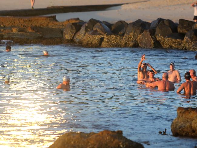 Bathers take advantage of the warm morning in Balmoral. Picture: John Grainger