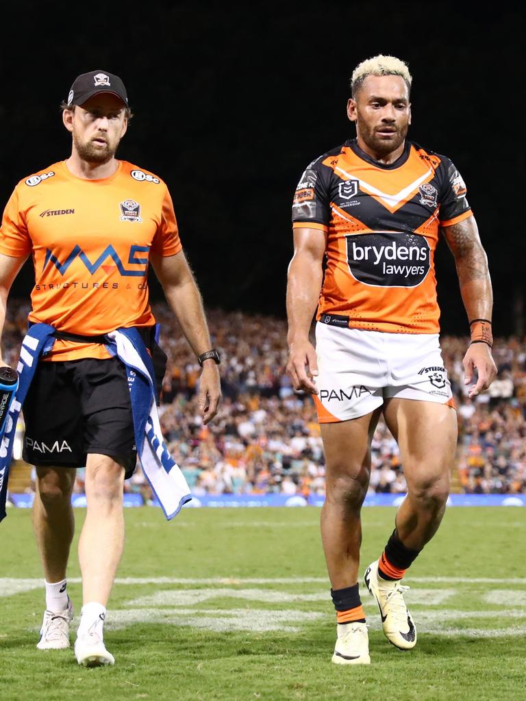 Apisai Koroisau of the Tigers walks off suffering cramp.