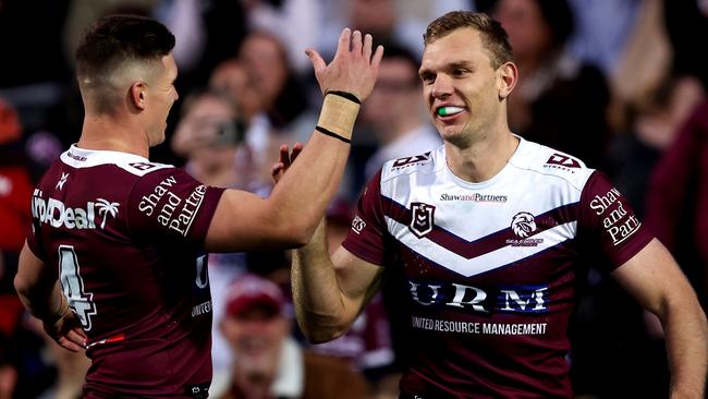 SYDNEY, AUSTRALIA - JULY 21: Tom Trbojevic of the Sea Eagles celebrates with team mate Reuben Garrick after scoring a try during the round 20 NRL match between Manly Sea Eagles and Gold Coast Titans at 4 Pines Park, on July 21, 2024, in Sydney, Australia. (Photo by Brendon Thorne/Getty Images)