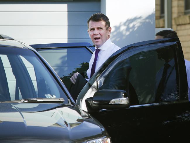 NSW Premier Mike Baird heads to work after fracturing his vertebrae. Picture: Virginia Young