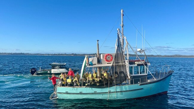 Terrified students have been pulled from a burning boat in a dramatic rescue on Port Phillip Bay on Thursday morning. Picture: 3AW