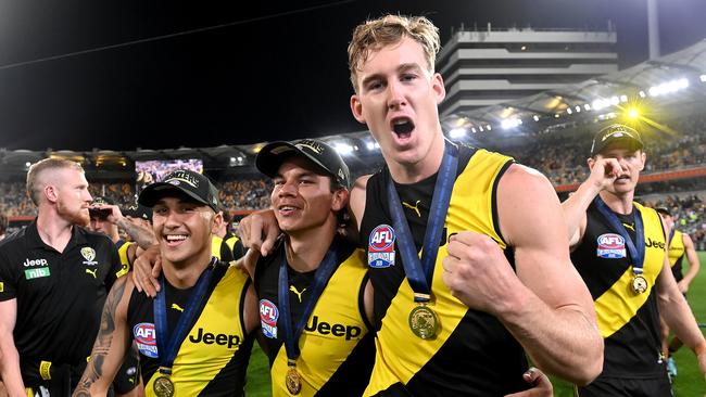 Shai Bolton, Daniel Rioli and Tom Lynch celebrate their 2020 premiership win. (Photo by Bradley Kanaris/AFL Photos/via Getty Images)