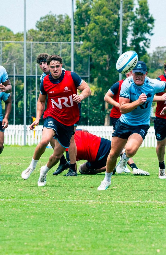 Waratahs five-eighth Tane Edmed chases a kick during training at NSW Rugby's practice field in Daceyville.