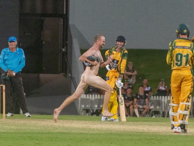 The streaker dashes across the pitch to the amusement of Pioneer Valley’s batters. Picture:Michaela Harlow