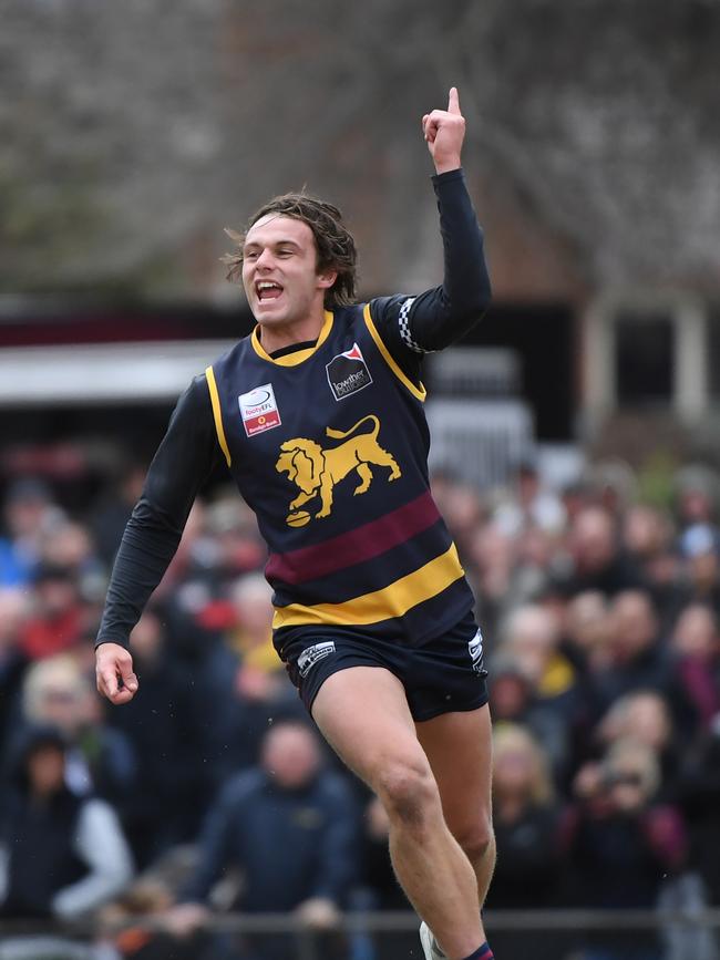Dylan Violjo-Rainbow celebrates a goal during the EFL Div 2 Grand Final.