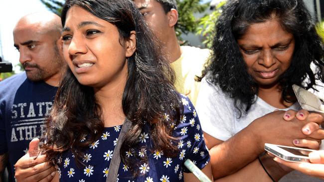 Raji Sukumaran (R) with Brintha Sukumaran (L) are overwhelmed as they visit Myuran at Kerobokan prison in Denpasar, two months before his execution. Photo-Nashyo Hansel