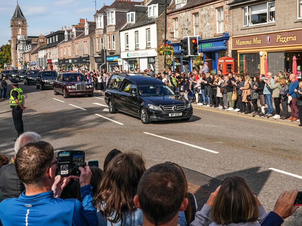 People gather in tribute as the cortege carrying the coffin of the late Queen Elizabeth II passes by in Banchory, UK. Picture: Getty Images.