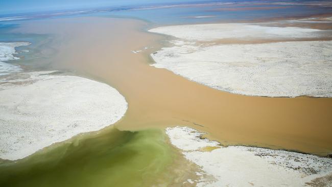 Flood water entering Warburton Groove at the northern end of Lake Eyre in 2015. Picture Russell Millard.