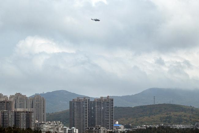 A Chinese military helicopter flies over Pingtan island, the closest point in China to Taiwan's main island, in Fujian province on May 19, 2024