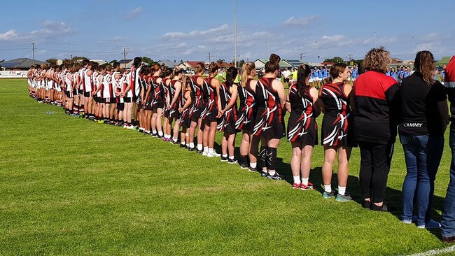 Eyre United footballers and netballers line up before this season's Anzac Day game. Picture: Eyre United Football Club