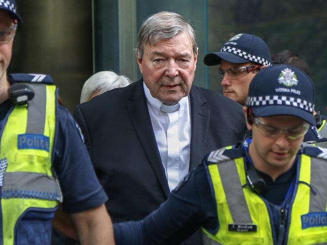 FILE - In this May 2, 2018, file photo, Cardinal George Pell, the most senior Catholic cleric to face sex charges, leaves court in Melbourne, Australia. Pell was sentenced in an Australian court on Wednesday, March 13, 2019 to 6 years in prison for molesting two choirboys in a Melbourne cathedral more than 20 years ago.  (AP Photo/Asanka Brendon Ratnayake, File)