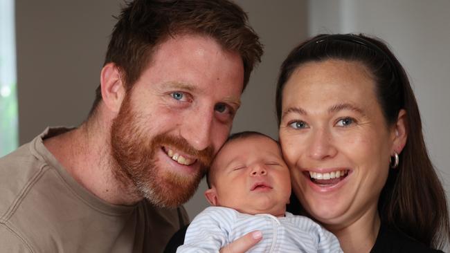 Former AFL player Reece Conca welcoming IVF miracle baby boy last week and talking about male infertility. Reece Conca with his partner Annabelle Grace and one week old baby boy Giovanni at home.                                                               Picture: David Caird