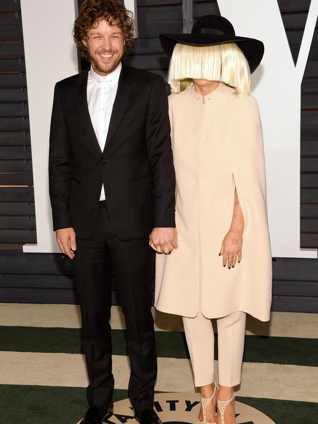 Erik Anders Lang and Sia arrive at the 2015 Vanity Fair Oscar Party. Picture: AP