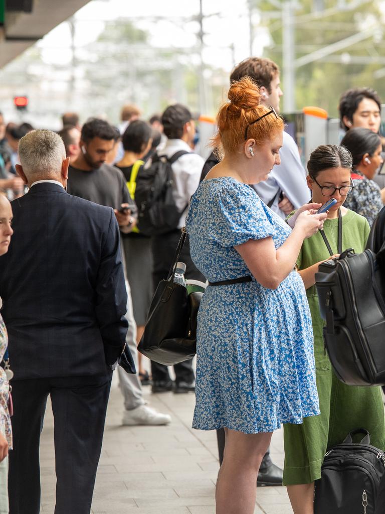 Commuters dealing with train delays and cancellations at Chatswood train station. Picture: Thomas Lisson