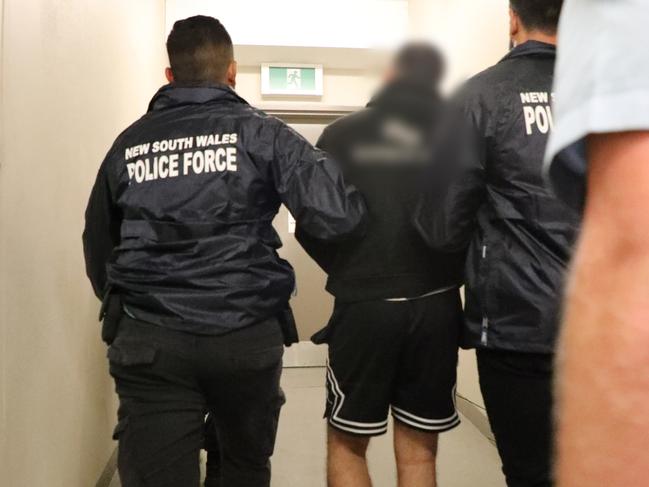 Dani Mansour was taken to Blacktown Police Station and charged with three offences. Picture: NSW Police