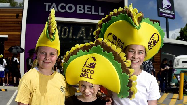 Taco Bell in Townsville has officially opened, attracting a long line of people and cars to the new restaurant. Luella Bright, 10, Poppi Bright, 8 and Mikayla Moore, 10 waiting in line. PICTURE: MATT TAYLOR.