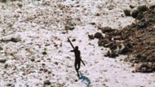 A file photo of a member of a Sentinelese tribe photographed firing arrows at a helicopter in 2004. The Sentinelese people are resistant to outsiders and often attack anyone who comes near. Picture: Supplied