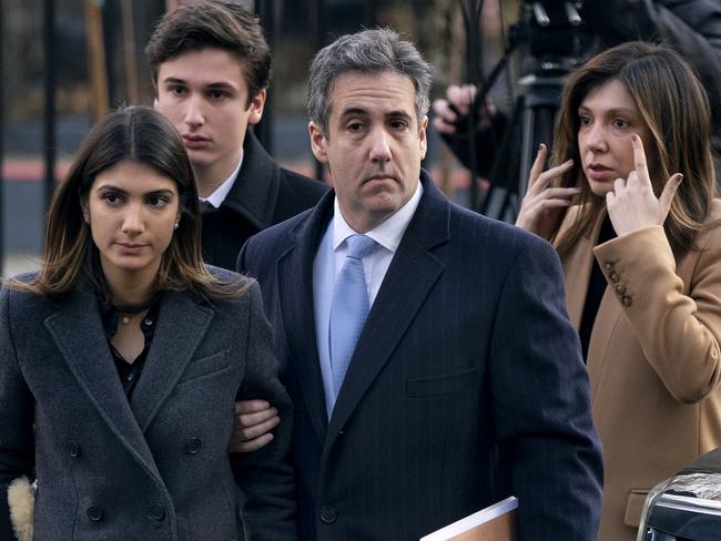 Michael Cohen, centre, President Donald Trump's former lawyer, accompanied by his children and wife, arrive at federal court for his sentencing for dodging taxes, lying to Congress and violating campaign finance laws. Picture: AP