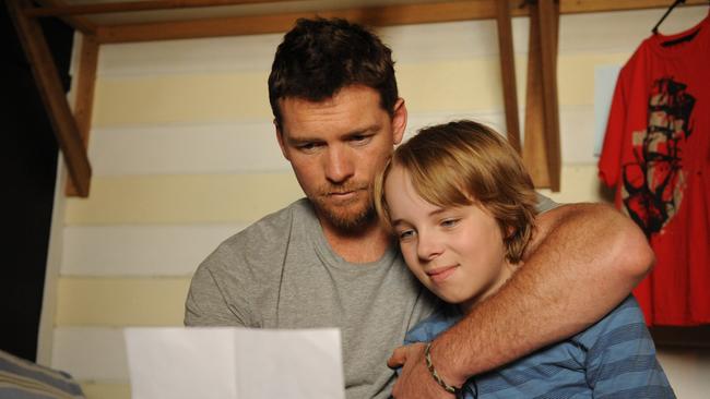 Struggle street ... Sam Worthington plays a depressed dad in Paper Planes.