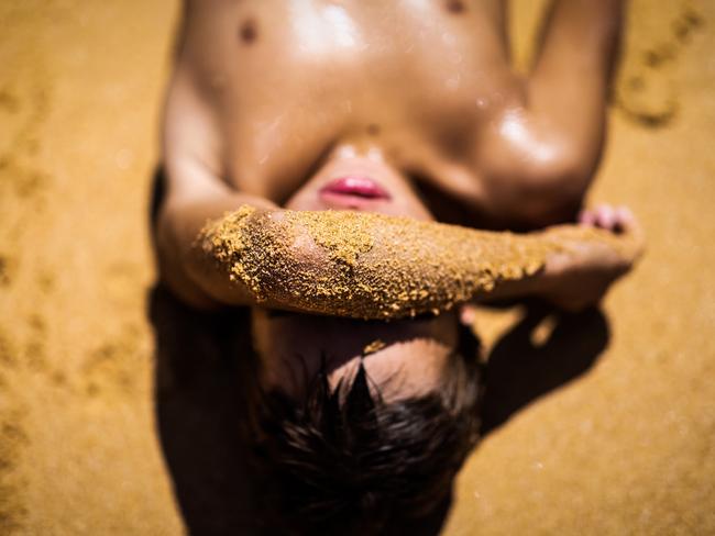 At North Narrabeen Beach in Sydney, a boy enjoys the sun as part of the 18th year of Bush to Beach, an initiative giving Indigenous children a chance to immerse in beach culture. Picture: Jenny Evans/Getty Images