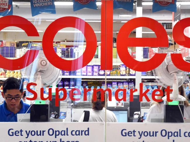 People are shopping at a Coles supermarket in the central business district of Sydney on March 16, 2018. Australian supermarket chain Coles will be spun off into a separate entity by owner Wesfarmers, the company said on March 16, amid a shake-up in the food retail sector as new entrants threaten a longstanding duopoly. / AFP PHOTO / William WEST