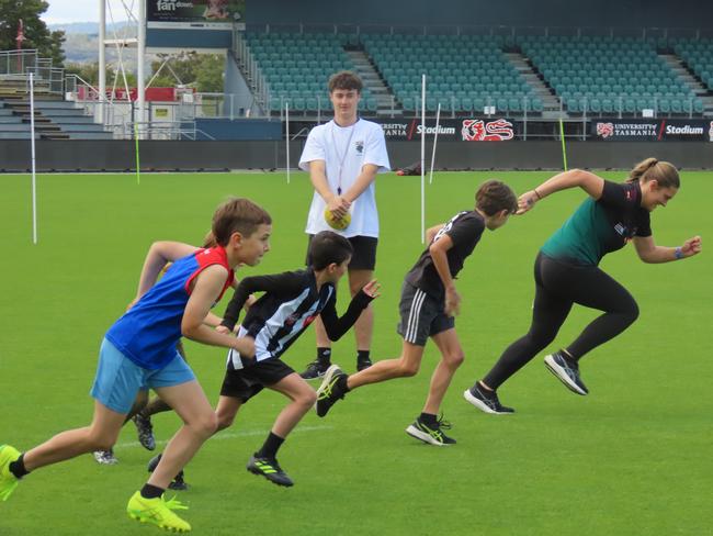 Kids taking part in drills at the Devils school holiday clinic at Launceston on Tuesday. Picture: Jon Tuxworth