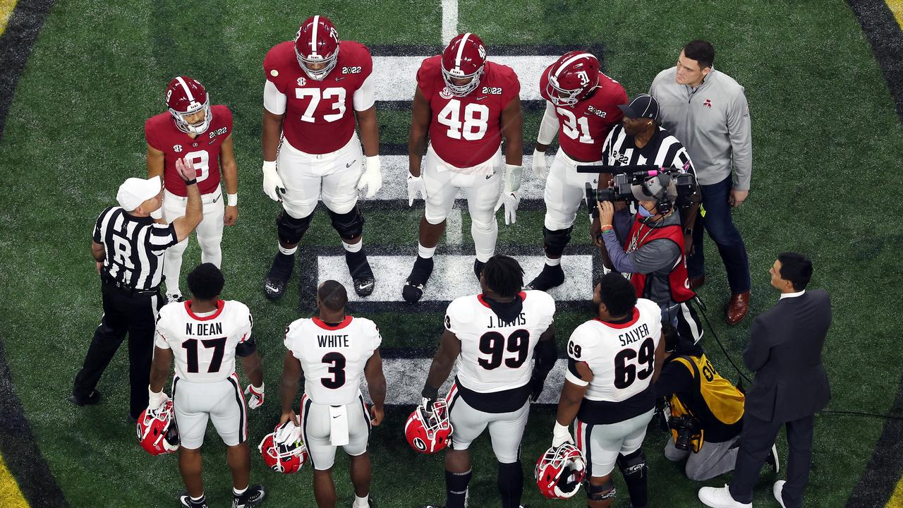 Alabama and Georgia players at the national championship game coin toss. (Photo by Dylan Buell/Getty Images)