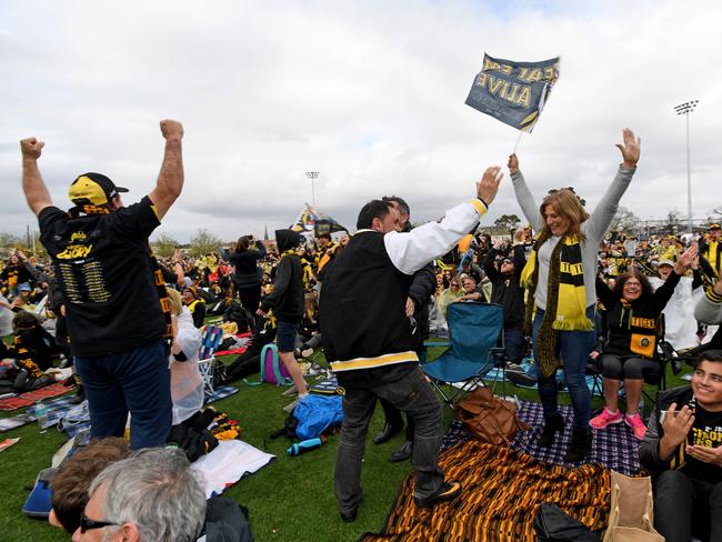 Tigers fans celebrate the team's win at Punt Road Oval. Picture: AAP/Joe Castro