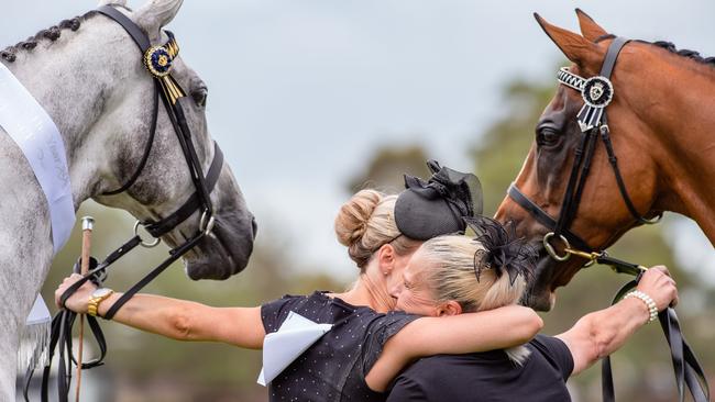 Winning feeling: Casey Bruce, with Chautauqua, hugs Sheralee Patterson holding Hartnell. Picture: Jason Edwards