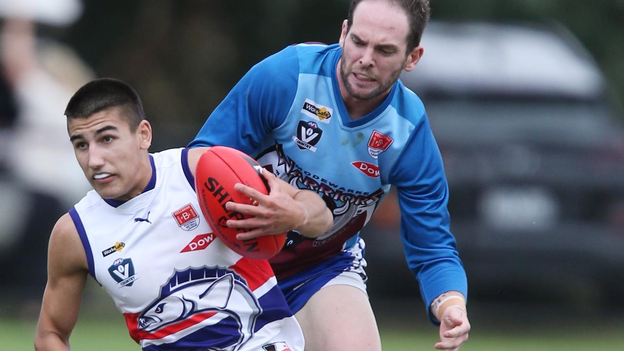 Football BFL: Modewarre v Queenscliff. Modewarre 16 Jackson OÃ&#149;Hanlon chases Queenscliff 57 Sol Bowtell Picture: Mark Wilson