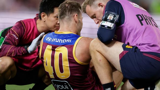 BRISBANE, AUSTRALIA - SEPTEMBER 07: Jack Payne of the Lions is seen in the hands of trainers during the 2024 AFL First Elimination Final match between the Brisbane Lions and the Carlton Blues at The Gabba on September 07, 2024 in Brisbane, Australia. (Photo by Russell Freeman/AFL Photos via Getty Images)