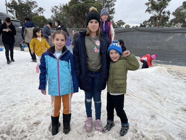 Brisbane family Rubie (10), Rhianna (11) and Phoenix Morrissey (6) play in the snowfields on day 2 of the 2021 Snowflakes in Stanthorpe festival. Photo: Madison Mifsud-Ure / Stanthorpe Border Post