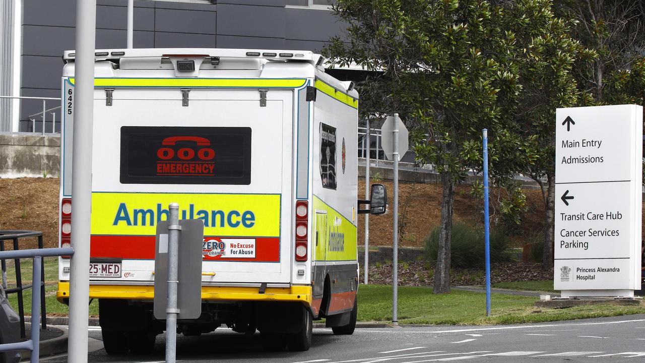 An ambulance arrives at the Princess Alexandra Hospital in Brisbane, where two separate COVID-19 clusters are under investigation. Photo: Tertius Pickard.