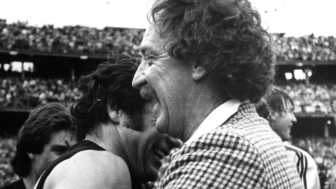 Tony Jewell and Tigers legend Francis Bourke embrace after their premiership win.