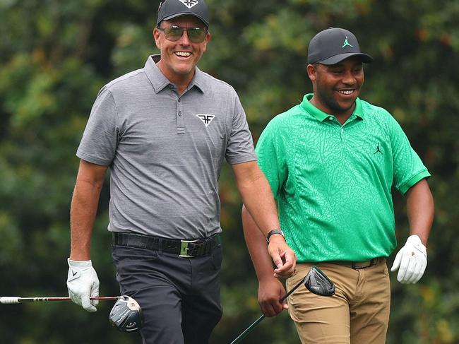 AUGUSTA, GEORGIA - APRIL 04: Phil Mickelson of the United States and Harold Varner III of the United States walk to the during a practice round prior to the 2023 Masters Tournament at Augusta National Golf Club on April 04, 2023 in Augusta, Georgia.   Andrew Redington/Getty Images/AFP (Photo by Andrew Redington / GETTY IMAGES NORTH AMERICA / Getty Images via AFP)