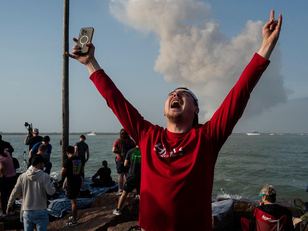 A spectator celebrates on South Padre Island. Picture: Veronica G. Cardenas/AFP