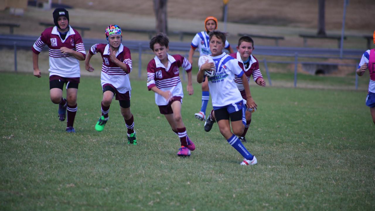 Collegians Jamaine Smith is pursued by Eastern Suburbs defenders in junior rugby league. Photo: Deanna Millard/Warwick Daily News