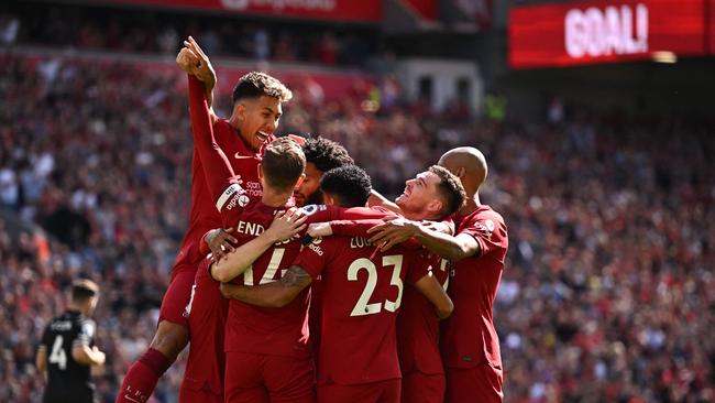 Liverpool's Colombian midfielder Luis Diaz (C) celebrates with teammates after scoring their first goal during the English Premier League football match between Liverpool and Bournemouth at Anfield in Liverpool, north west England on August 27, 2022. (Photo by Oli SCARFF / AFP) / RESTRICTED TO EDITORIAL USE. No use with unauthorized audio, video, data, fixture lists, club/league logos or 'live' services. Online in-match use limited to 120 images. An additional 40 images may be used in extra time. No video emulation. Social media in-match use limited to 120 images. An additional 40 images may be used in extra time. No use in betting publications, games or single club/league/player publications. /