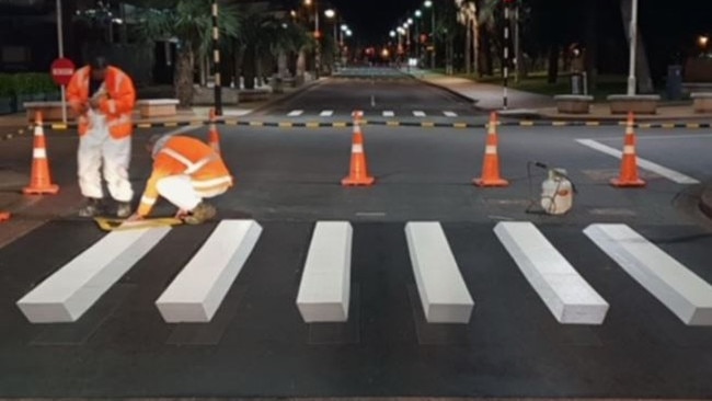 A '3D' pedestrian crossing being painted in Europe. Picture: Supplied