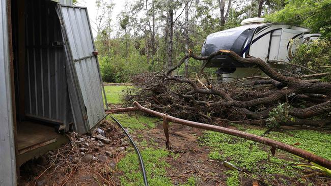 A car, tractor, fence panels and contents from inside steel sheds were strewn across the property when Lynette Lynch returned. Picture: Adam Head