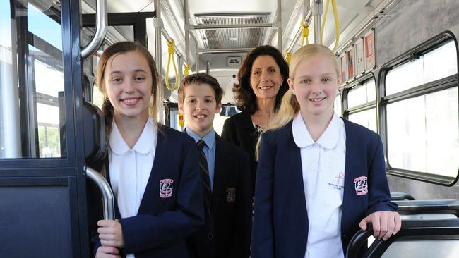 The school’s uniform will also change. Pictured from left are students, Koby Rundle, Year 7, Lachlan Degarnham, Year 8, Jasmine Sultana, Year 7, and former school principal Robyn Meddows.